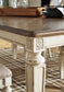 Realyn Dining Table and 8 Chairs Smyrna Furniture Outlet