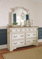 Realyn Queen Upholstered Panel Bed with Mirrored Dresser and Chest Smyrna Furniture Outlet