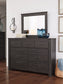Brinxton Queen Panel Bed with Mirrored Dresser, Chest and 2 Nightstands Smyrna Furniture Outlet